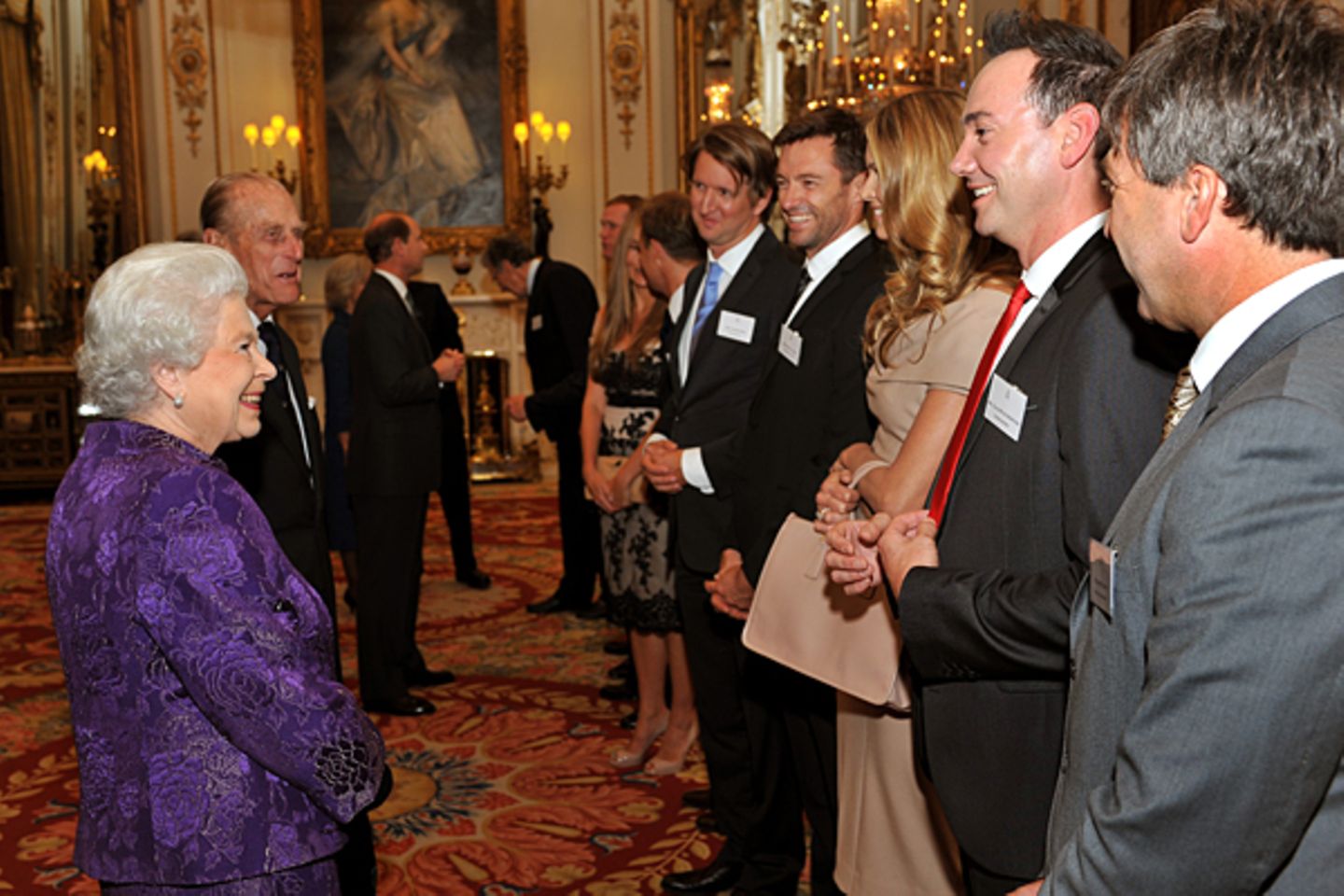 2011: Königin Elisabeth II. und Hugh Jackman, Elle MacPherson