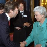 2005: Königin Elisabeth II. und Eric Clapton, Brian May