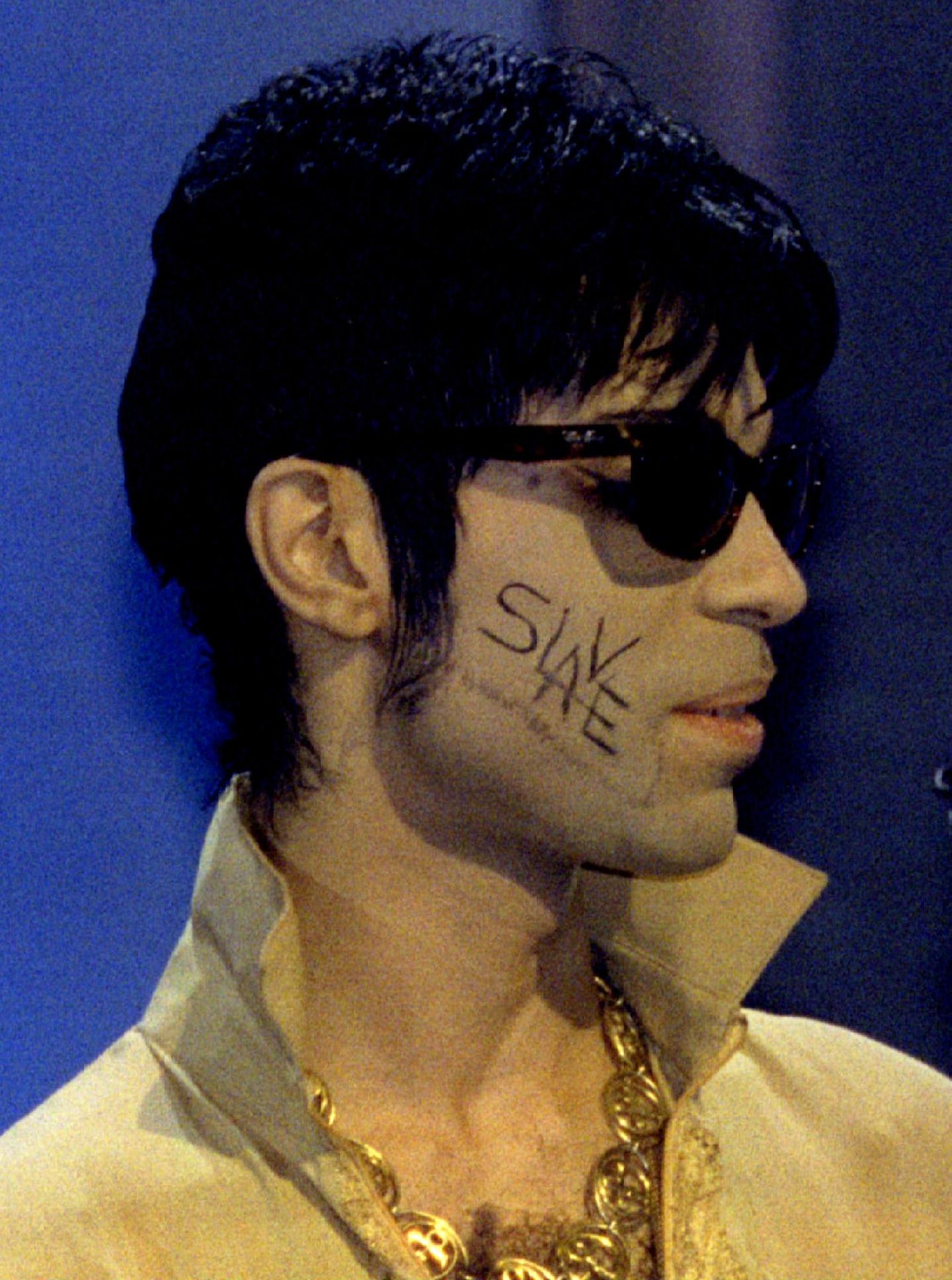 Anfang der Neunzigerjahre firmierte er nicht mehr als Prince. Statt eines Namens firmierte er nur noch unter einem Symbol oder auch als TAFKAP, The Artist Formerly Known As Prince. Nachdem er sich im Streit über die Verträge und Musikrechte von seinem Plattenlabel getrennt hatte, schrieb er sich aus Protest bei Auftritten das Wort "Slave" auf die Wange.