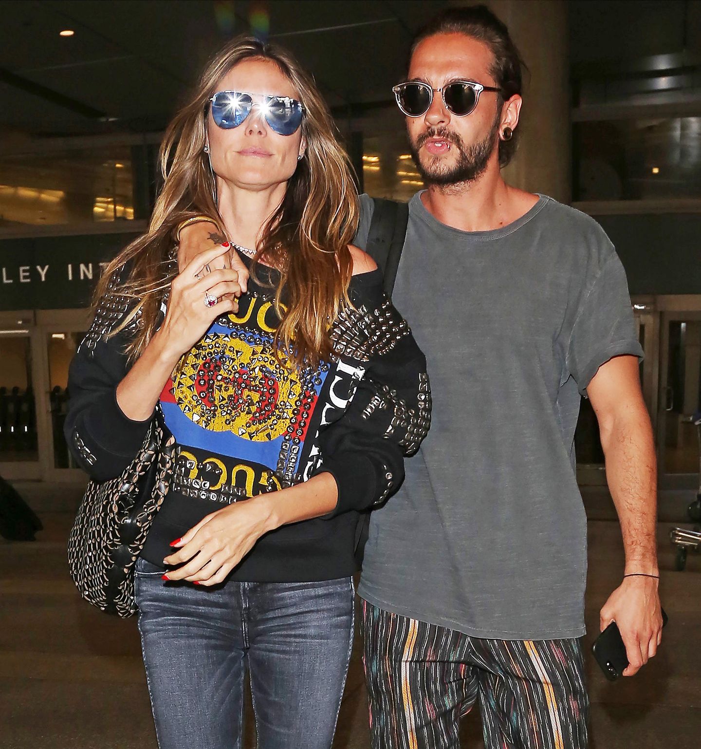 12. April 2018  Heidi Klum und Tom Kaulitz wirken sehr vertraut, als sie am Flughafen "LAX" in Los Angeles gesichtet werden.