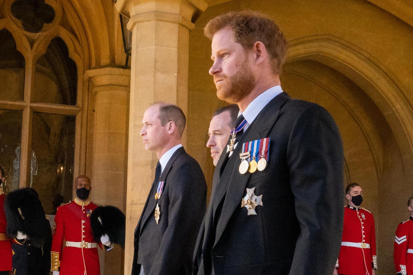 Prince Harry and Prince William next to Peter Phillips at the funeral service of Prince Philip (on 99) on 17 April 2021