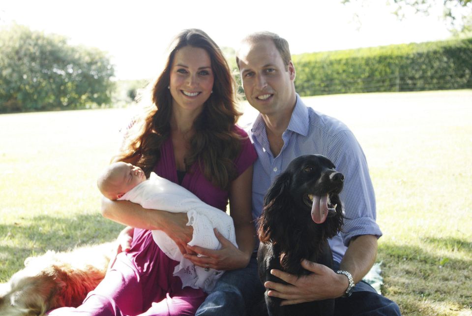 Duchess Catherine and Prince William with Prince George and the dog Lupo
