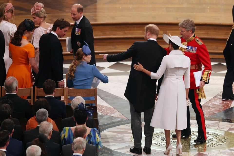 Prince Harry and the Duchess were escorted to their seats in the middle of the second row of seats for members of the royal family, which was some distance from the seats of Prince Charles, Duchess Camilla, Prince William and Duchess Catherine. 