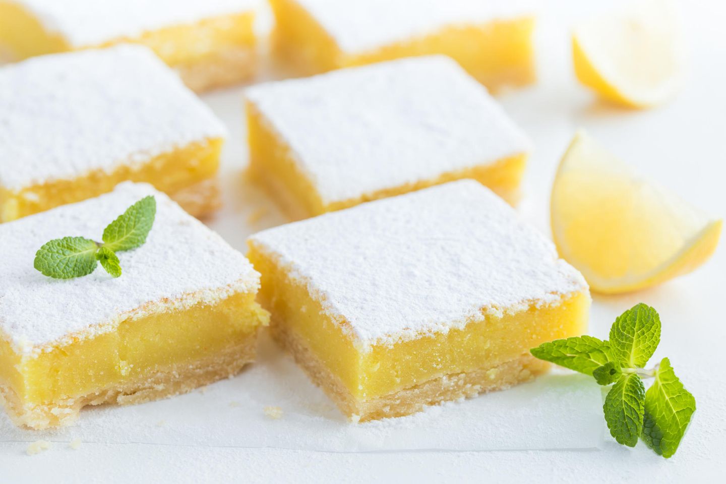 A divine treat: lemon tart arranged on a white tablecloth